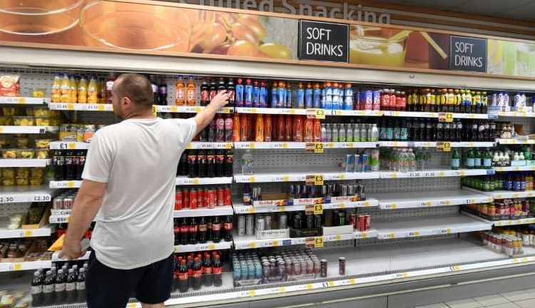 Des étagères vides dans un supermarché Tesco à Londres le 22 juillet 2021 - JUSTIN TALLIS © 2019 AFP